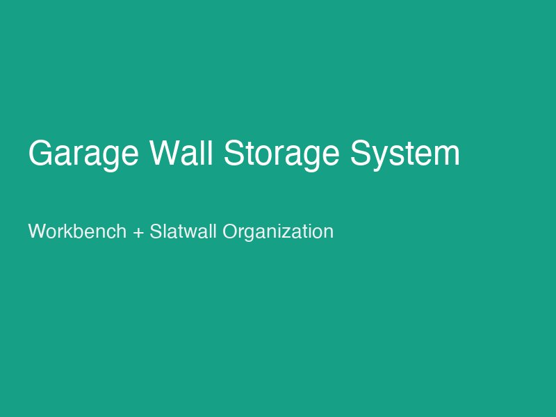 Well-organised garage wall with slatwall system holding tools, above a wooden workbench